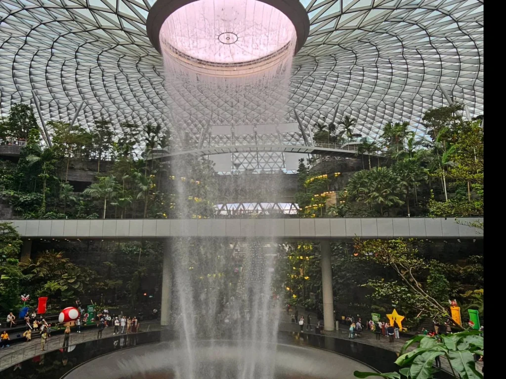 A Comprehensive Exploration of Singapore: From Jewel at Changi Airport to Peninsula Excelsior Hotel and Chinatown Delights 3 Cruising with Danny and Peter, Holland America Line, Westerdam, Singapore | Jewel at Changi Airport with the world’s tallest indoor waterfall, luxurious skyline view from Peninsula Excelsior Hotel, and vibrant street food and dim sum in Chinatown Singapore, showcasing a blend of modern architecture, luxury accommodation, and rich culinary experiences.