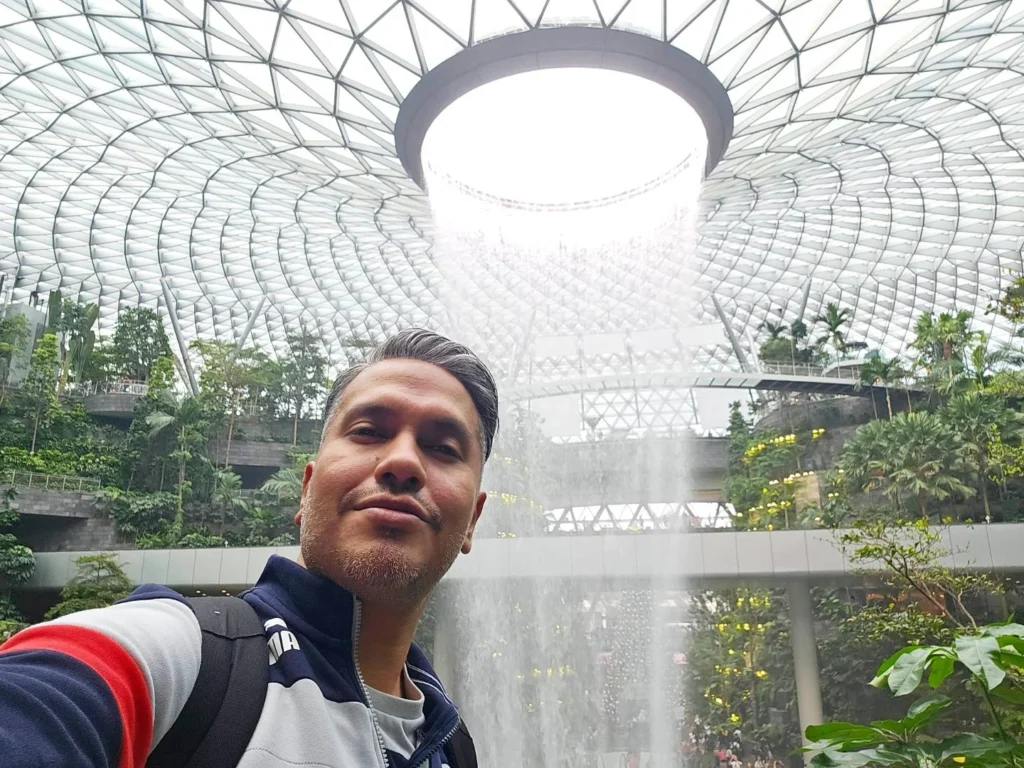 A Comprehensive Exploration of Singapore: From Jewel at Changi Airport to Peninsula Excelsior Hotel and Chinatown Delights 8 Cruising with Danny and Peter, Holland America Line, Westerdam, Singapore | Jewel at Changi Airport with the world’s tallest indoor waterfall, luxurious skyline view from Peninsula Excelsior Hotel, and vibrant street food and dim sum in Chinatown Singapore, showcasing a blend of modern architecture, luxury accommodation, and rich culinary experiences.