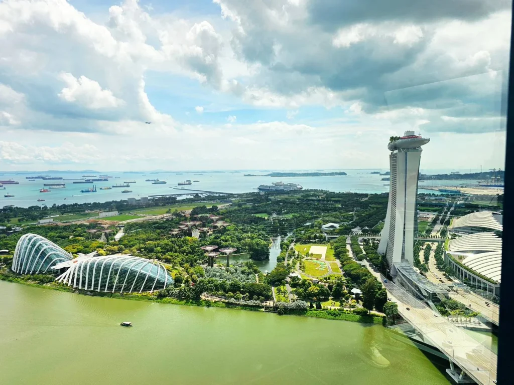 Cruising with Danny and Peter, Holland America Line, Westerdam, Singapore | View of Singapore's skyline from the Singapore Flyer during a spectacular adventure, showcasing iconic landmarks and vibrant cityscapes.