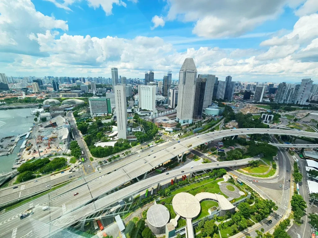 Cruising with Danny and Peter, Holland America Line, Westerdam, Singapore | View of Singapore's skyline from the Singapore Flyer during a spectacular adventure, showcasing iconic landmarks and vibrant cityscapes.