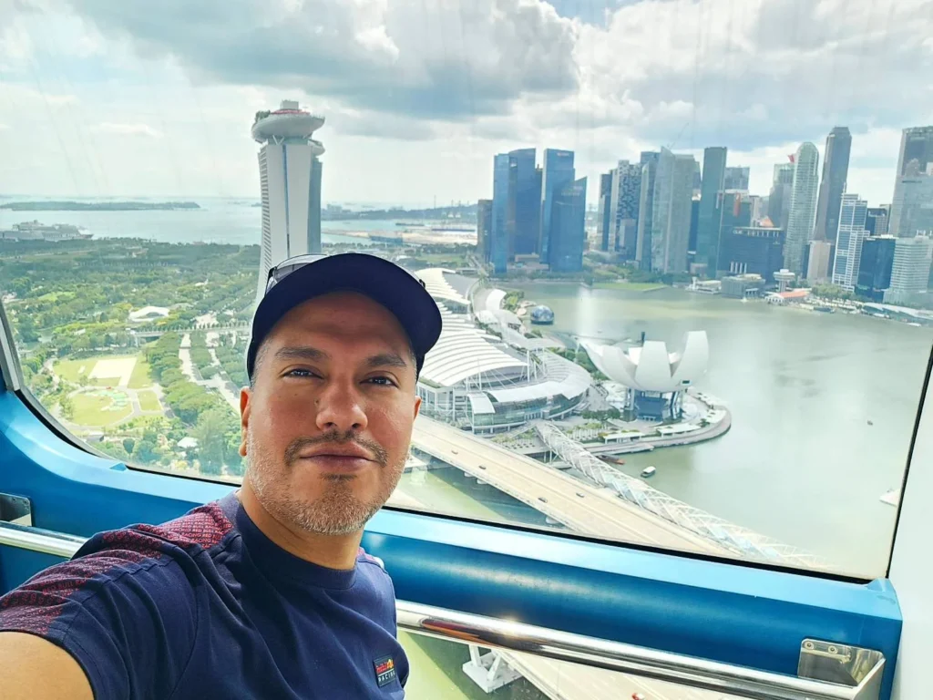 Cruising with Danny and Peter, Holland America Line, Westerdam, Singapore | View of Singapore's skyline from the Singapore Flyer during a spectacular adventure, showcasing iconic landmarks and vibrant cityscapes.