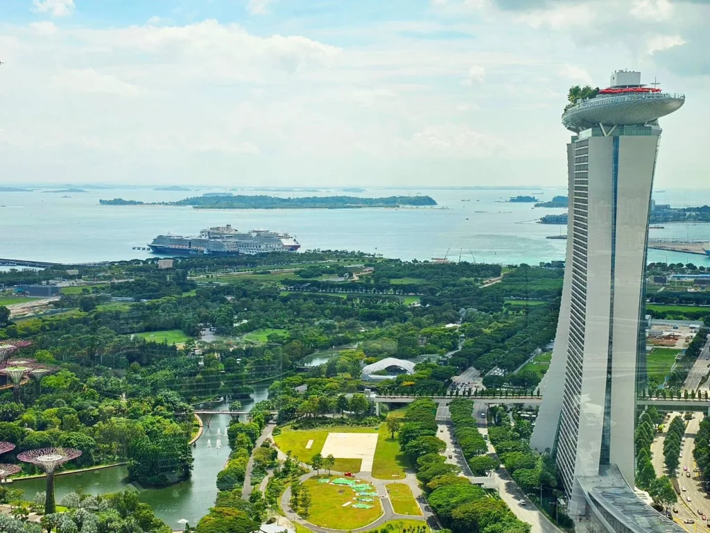 Cruising with Danny and Peter, Holland America Line, Westerdam, Singapore | View of Singapore's skyline from the Singapore Flyer during a spectacular adventure, showcasing iconic landmarks and vibrant cityscapes.