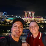 Cruising with Danny and Peter, Holland America Line, Westerdam, Singapore | View of Singapore's skyline from the Singapore Flyer during a spectacular adventure, showcasing iconic landmarks and vibrant cityscapes.