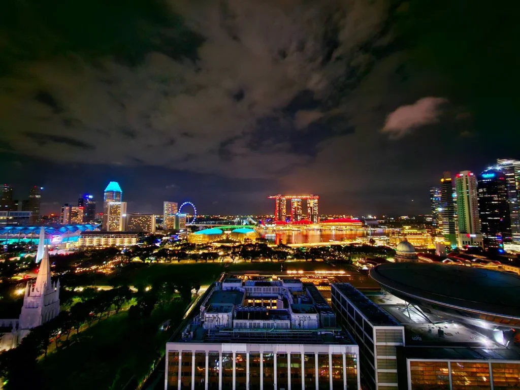 Cruising with Danny and Peter, Holland America Line, Westerdam, Singapore | View of Singapore's skyline from the Singapore Flyer during a spectacular adventure, showcasing iconic landmarks and vibrant cityscapes.