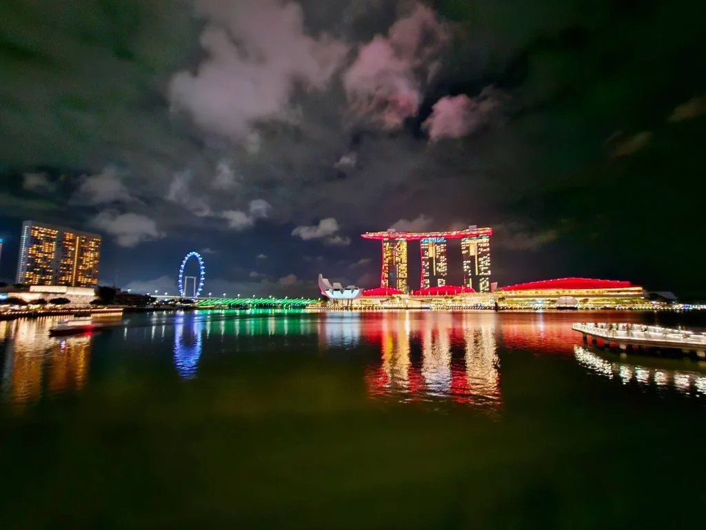 Cruising with Danny and Peter, Holland America Line, Westerdam, Singapore | View of Singapore's skyline from the Singapore Flyer during a spectacular adventure, showcasing iconic landmarks and vibrant cityscapes.