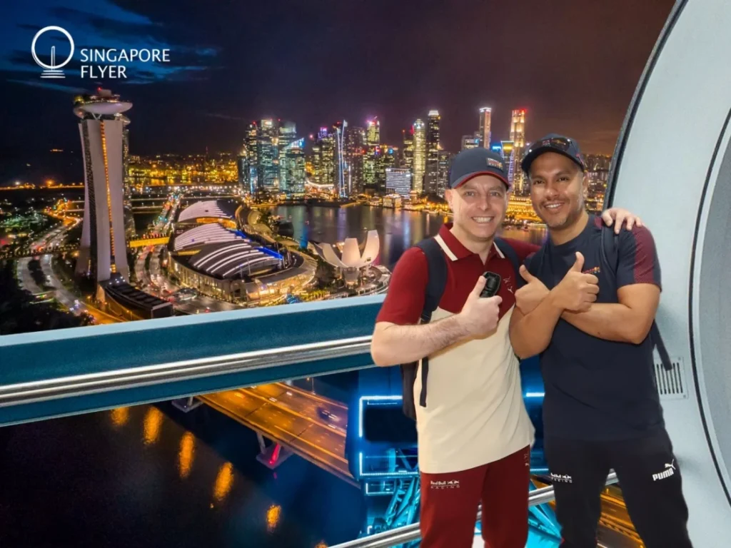 Cruising with Danny and Peter, Holland America Line, Westerdam, Singapore | View of Singapore's skyline from the Singapore Flyer during a spectacular adventure, showcasing iconic landmarks and vibrant cityscapes.