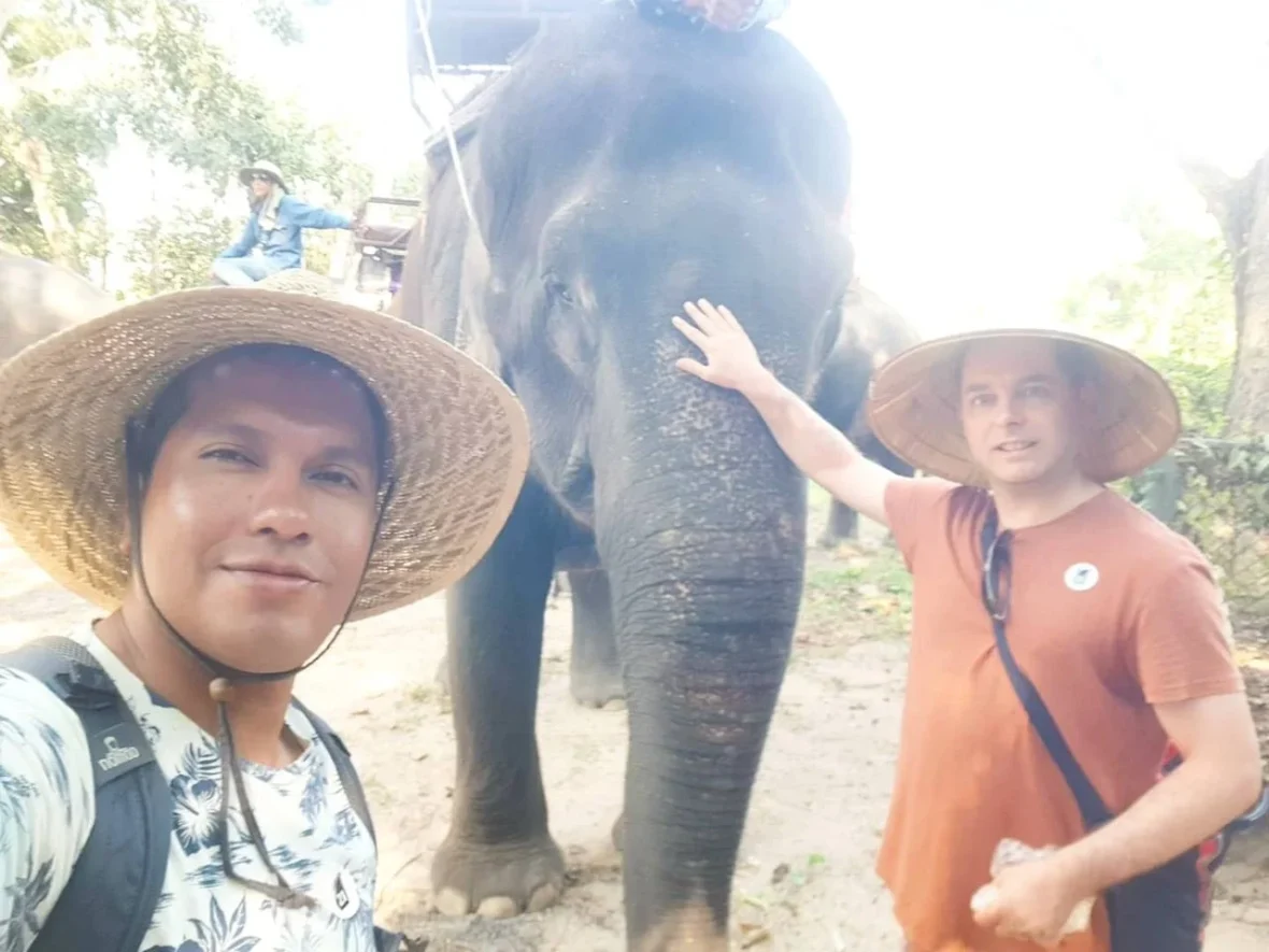 Cruising with Danny and Peter, Holland America Line, Westerdam, Laem Chabang, Bangkok, Thailand | Visitors enjoying wildlife encounters and interactive experiences at Elephant Village Pattaya, surrounded by majestic elephants, tropical birds, and vibrant Thai cultural shows, capturing the essence of nature and entertainment in Pattaya.