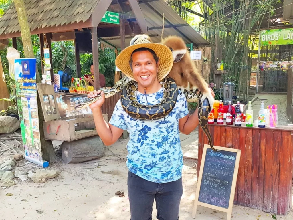 Cruising with Danny and Peter, Holland America Line, Westerdam, Laem Chabang, Bangkok, Thailand | Visitors enjoying wildlife encounters and interactive experiences at Elephant Village Pattaya, surrounded by majestic elephants, tropical birds, and vibrant Thai cultural shows, capturing the essence of nature and entertainment in Pattaya.