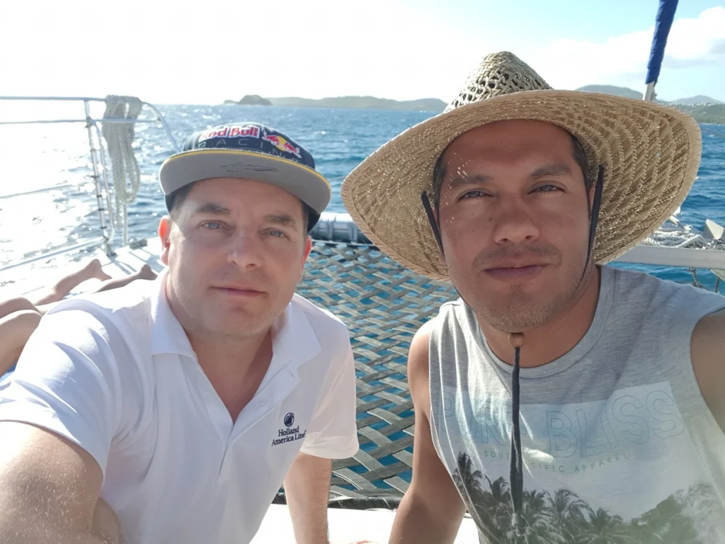 Cruising with Danny and Peter, Holland America Line, Zuiderdam, Charlotte Amalie, US Virgin Islands | A scenic view of a luxury catamaran sailing in the tranquil Caribbean waters near Charlotte Amalie, showcasing stunning landscapes of the U.S. Virgin Islands, vibrant marine life during snorkeling excursions, and secluded Caribbean beaches ideal for exploration.