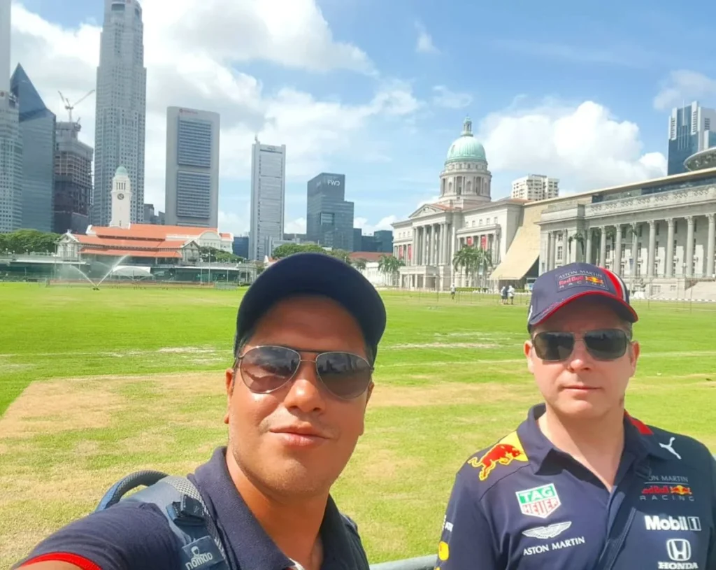 Cruising with Danny and Peter, Holland America Line, Westerdam, Singapore | Singapore bike tour through vibrant cityscapes with historic Chinatown and modern Orchard Road, ending with the Marina Bay water and light show featuring the Marina Bay Sands light display and stunning fountain show.