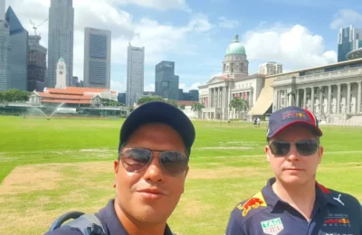 Cruising with Danny and Peter, Holland America Line, Westerdam, Singapore | Singapore bike tour through vibrant cityscapes with historic Chinatown and modern Orchard Road, ending with the Marina Bay water and light show featuring the Marina Bay Sands light display and stunning fountain show.