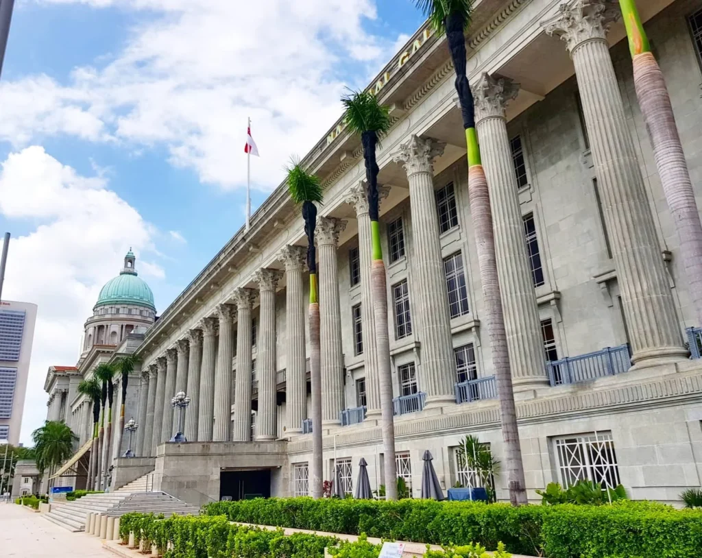 Cruising with Danny and Peter, Holland America Line, Westerdam, Singapore | Singapore bike tour through vibrant cityscapes with historic Chinatown and modern Orchard Road, ending with the Marina Bay water and light show featuring the Marina Bay Sands light display and stunning fountain show.