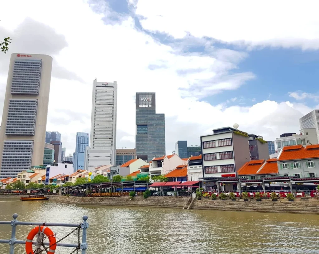 Cruising with Danny and Peter, Holland America Line, Westerdam, Singapore | Singapore bike tour through vibrant cityscapes with historic Chinatown and modern Orchard Road, ending with the Marina Bay water and light show featuring the Marina Bay Sands light display and stunning fountain show.