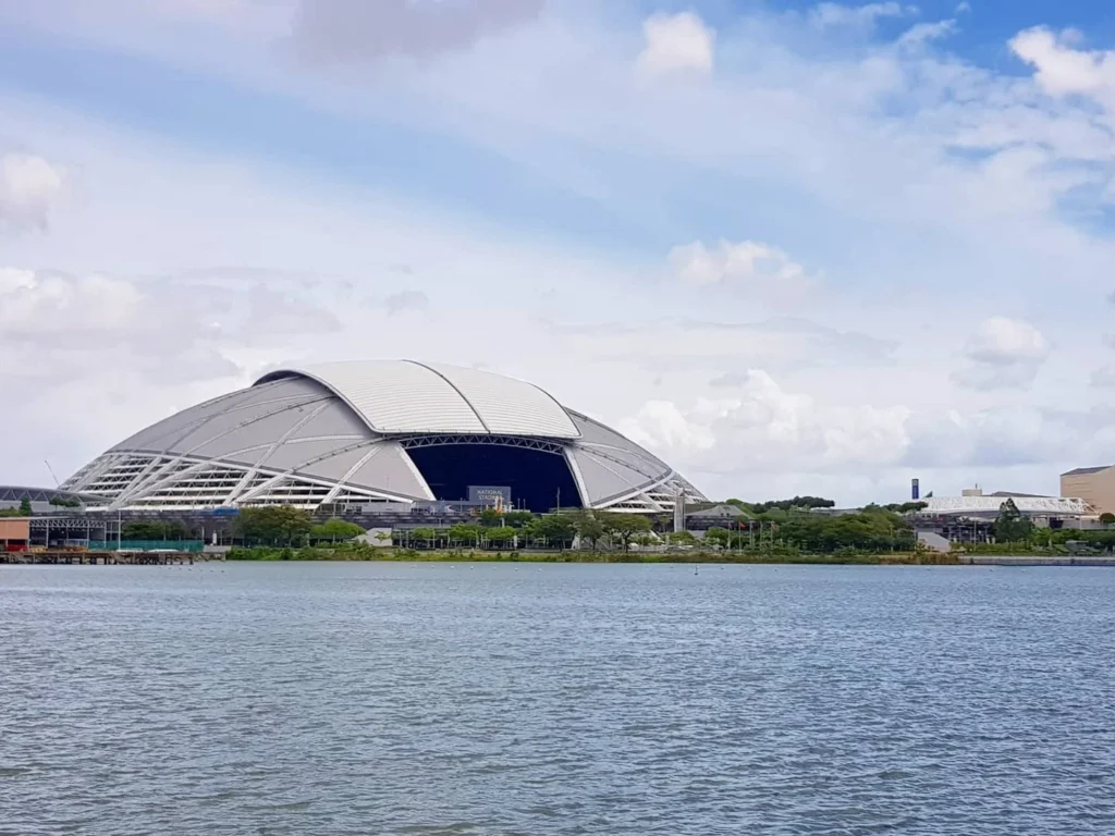 Cruising with Danny and Peter, Holland America Line, Westerdam, Singapore | Singapore bike tour through vibrant cityscapes with historic Chinatown and modern Orchard Road, ending with the Marina Bay water and light show featuring the Marina Bay Sands light display and stunning fountain show.