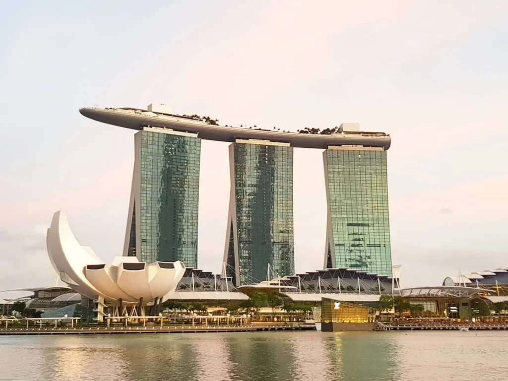 Cruising with Danny and Peter, Holland America Line, Westerdam, Singapore | Singapore bike tour through vibrant cityscapes with historic Chinatown and modern Orchard Road, ending with the Marina Bay water and light show featuring the Marina Bay Sands light display and stunning fountain show.