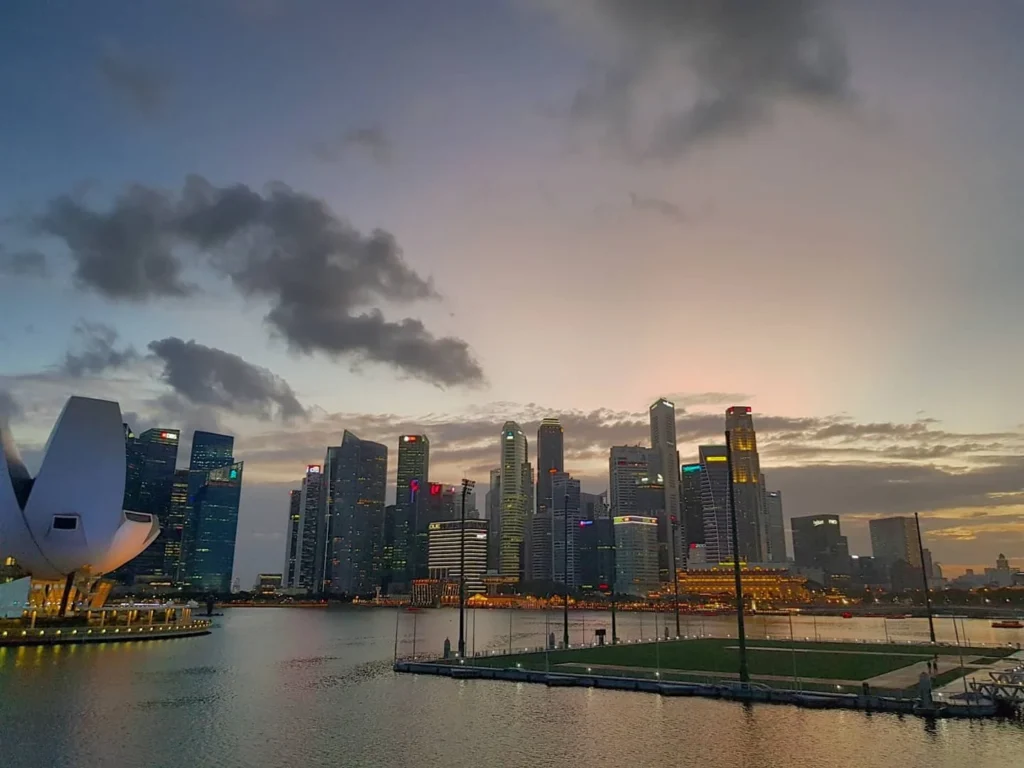 Cruising with Danny and Peter, Holland America Line, Westerdam, Singapore | Singapore bike tour through vibrant cityscapes with historic Chinatown and modern Orchard Road, ending with the Marina Bay water and light show featuring the Marina Bay Sands light display and stunning fountain show.