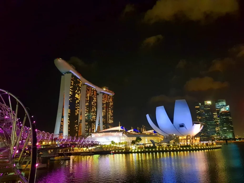 Cruising with Danny and Peter, Holland America Line, Westerdam, Singapore | Singapore bike tour through vibrant cityscapes with historic Chinatown and modern Orchard Road, ending with the Marina Bay water and light show featuring the Marina Bay Sands light display and stunning fountain show.