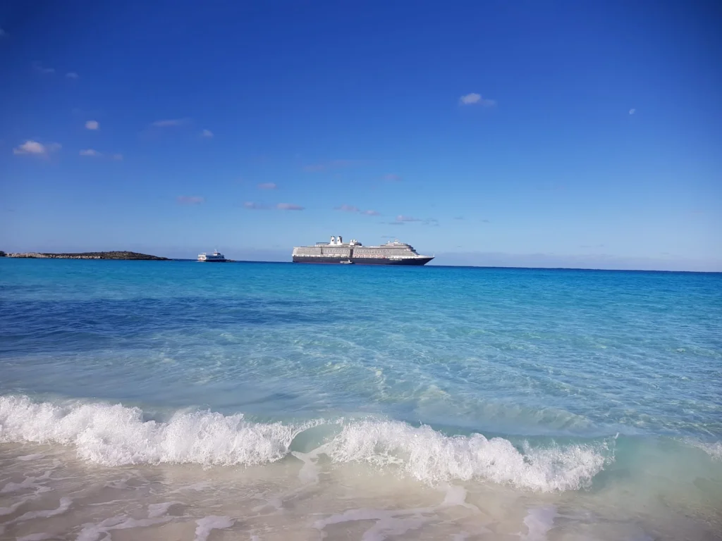 Cruising with Danny and Peter, Holland America Line, Nieuw Amsterdam, Half Moon Cay, Bahamas | Visitors enjoy a thrilling Half Moon Cay stingray adventure, snorkeling with gentle stingrays in crystal-clear Caribbean waters, surrounded by pristine beaches and tropical scenery.
