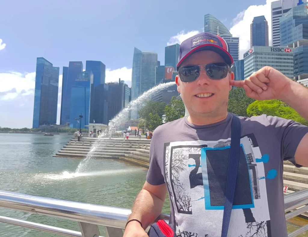 Cruising with Danny and Peter, Holland America Line, Westerdam, Singapore | Singapore Travel Highlights featuring the iconic Merlion Statue, vibrant Chinatown Experience with bustling markets and temples, and a scenic Singapore Skyline Dinner with fresh seafood dining.