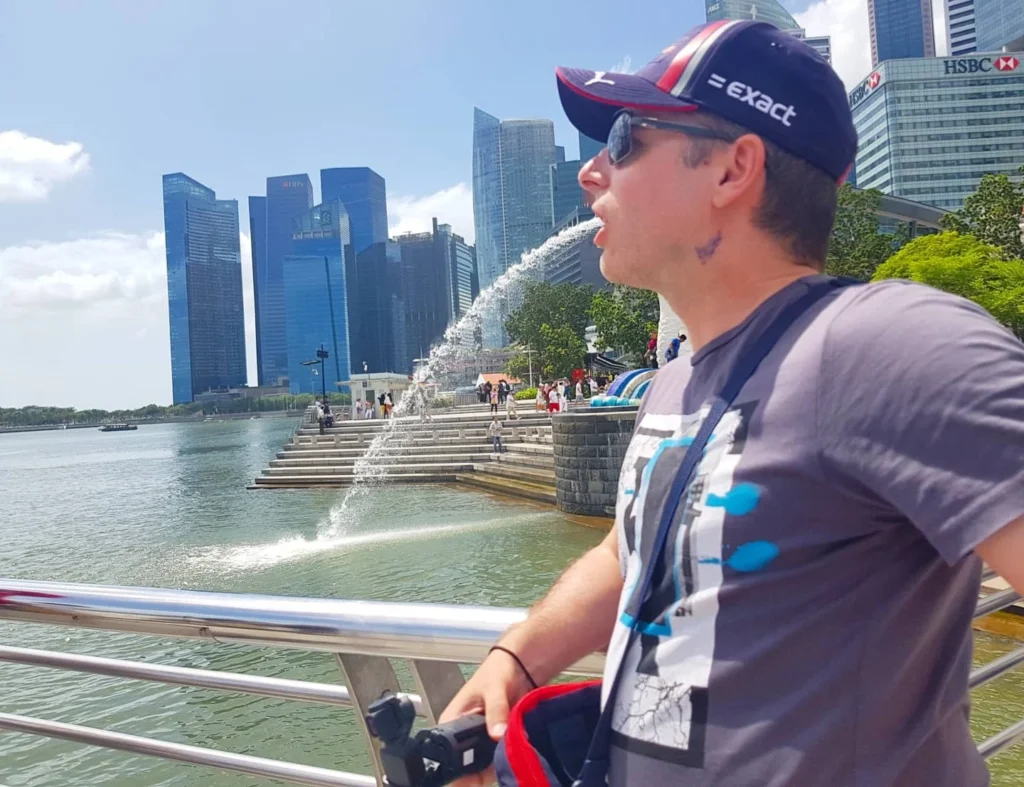 Cruising with Danny and Peter, Holland America Line, Westerdam, Singapore | Singapore Travel Highlights featuring the iconic Merlion Statue, vibrant Chinatown Experience with bustling markets and temples, and a scenic Singapore Skyline Dinner with fresh seafood dining.
