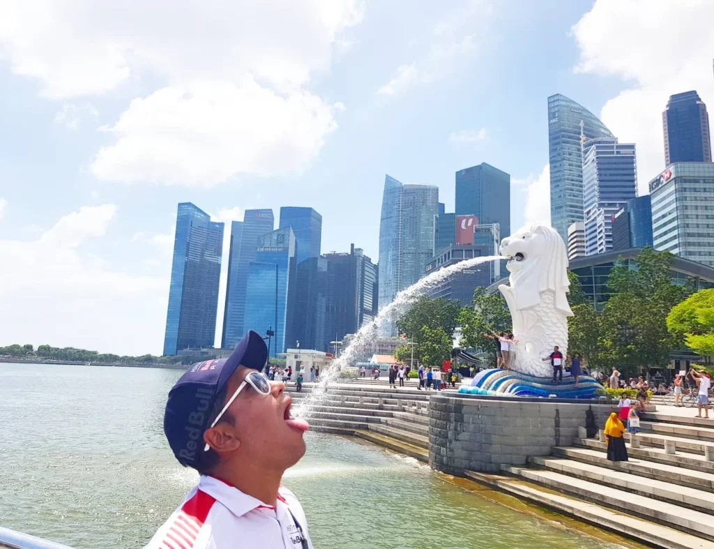 Cruising with Danny and Peter, Holland America Line, Westerdam, Singapore | Singapore Travel Highlights featuring the iconic Merlion Statue, vibrant Chinatown Experience with bustling markets and temples, and a scenic Singapore Skyline Dinner with fresh seafood dining.