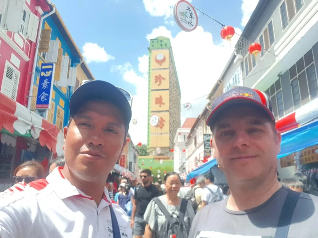 Cruising with Danny and Peter, Holland America Line, Westerdam, Singapore | Singapore Travel Highlights featuring the iconic Merlion Statue, vibrant Chinatown Experience with bustling markets and temples, and a scenic Singapore Skyline Dinner with fresh seafood dining.