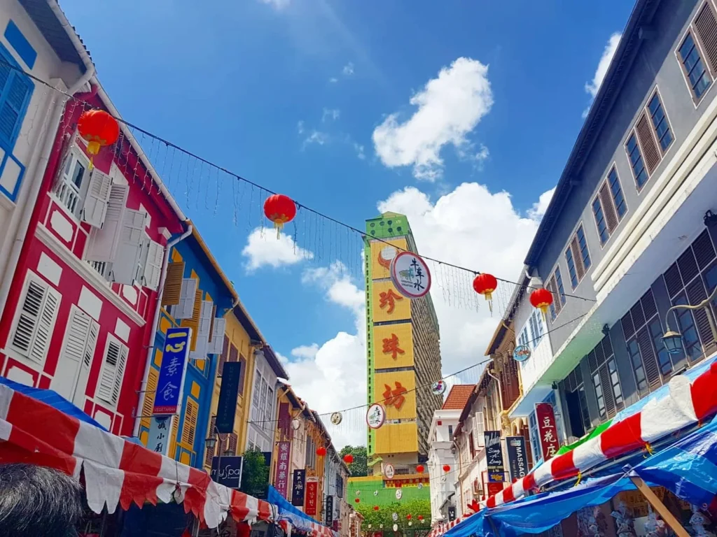 Cruising with Danny and Peter, Holland America Line, Westerdam, Singapore | Singapore Travel Highlights featuring the iconic Merlion Statue, vibrant Chinatown Experience with bustling markets and temples, and a scenic Singapore Skyline Dinner with fresh seafood dining.
