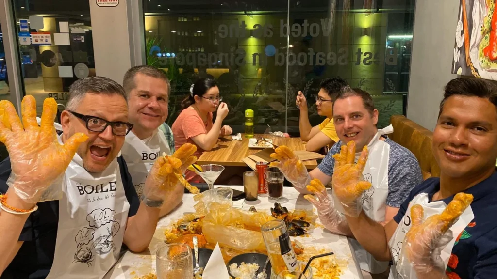Cruising with Danny and Peter, Holland America Line, Westerdam, Singapore | Singapore Travel Highlights featuring the iconic Merlion Statue, vibrant Chinatown Experience with bustling markets and temples, and a scenic Singapore Skyline Dinner with fresh seafood dining.