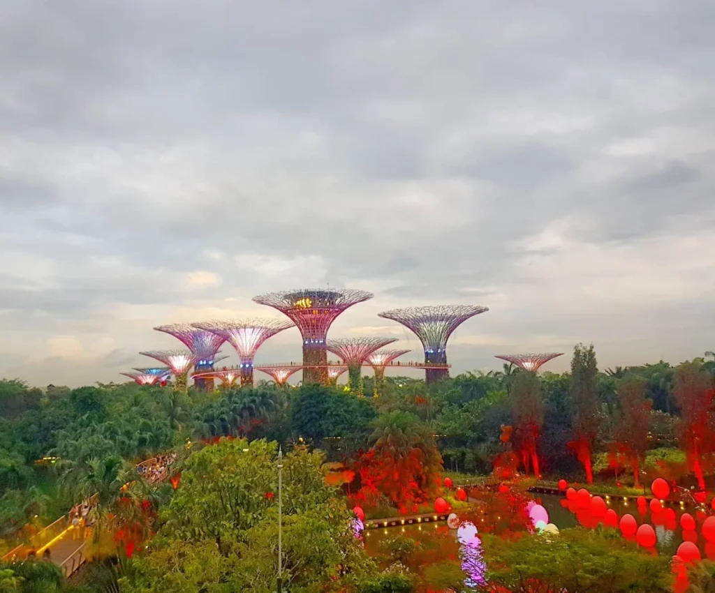 Cruising with Dannay and Peter, Holland America Line, Westerdam, Singapore | Image of Gardens by the Bay's Supertree Grove, Flower Dome Singapore, Cloud Forest Dome, and Changi Airport Jewel with Rain Vortex showcasing Singapore Gardens highlights.
