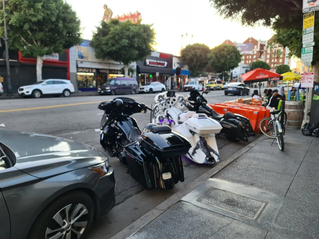 Cruising with Danny and Peter, Holland America Line, Koningsdam, Los Angeles, California, United States | Hollywood Day Trip highlights: A steaming plate of sizzling bacon and freshly brewed coffee sets the stage for an exciting day exploring Los Angeles. Iconic landmarks like the Warner Bros Studio, showcasing Central Perk from Friends and Hogwarts from Harry Potter, bring movie magic to life. The glimmering Hollywood Walk of Fame features brass stars of legends like Marilyn Monroe, captured in crowd-free morning photos along bustling Hollywood Boulevard. The majestic Dolby Theatre dazzles with its Oscar stage and rich stories of Hollywood royalty. The famous Hollywood Sign stands tall against panoramic views of LA, offering a perfect photo backdrop, especially at sunset. Sunset Boulevard pulses with life, trendy cafés, and vibrant local flavors, culminating in a relaxing al fresco dinner under warm California skies. This cinematic adventure encapsulates the glamour, history, and charm of a quintessential Tinseltown experience.