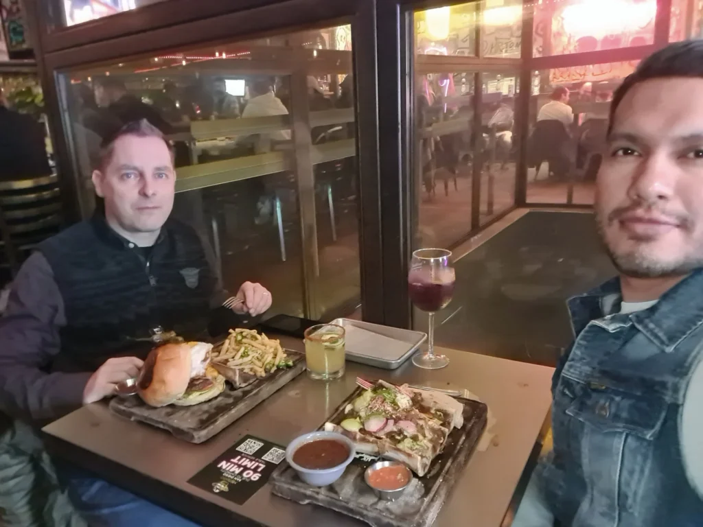 Cruising with Danny and Peter, Holland America Line, Koningsdam, San Diego, California, United States | A vibrant scene from our San Diego Food Tour, featuring a delicious plate of huevos rancheros at a charming Little Italy café, lush gardens and Spanish-influenced architecture in Balboa Park, the imposing USS Midway aircraft carrier museum, and an evening spread of flavorful Mexican dishes, capturing the essence of a Cultural and Culinary Exploration in San Diego.