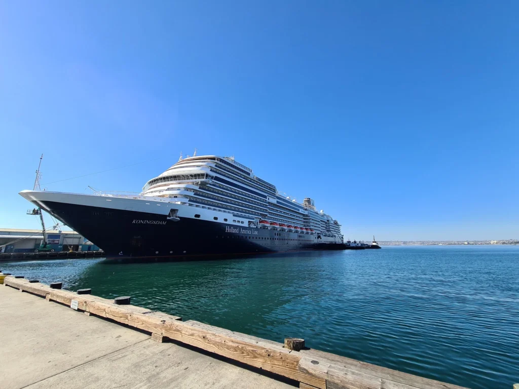Cruising with Danny and Peter, Holland America Line, Koningsdam, San Diego, California, United States | Guests enjoying a seamless Cruise Embarkation Day with a special Birthday Celebration on Cruise Ship, featuring a warm welcome, joyful moments, and a festive atmosphere on the deck.