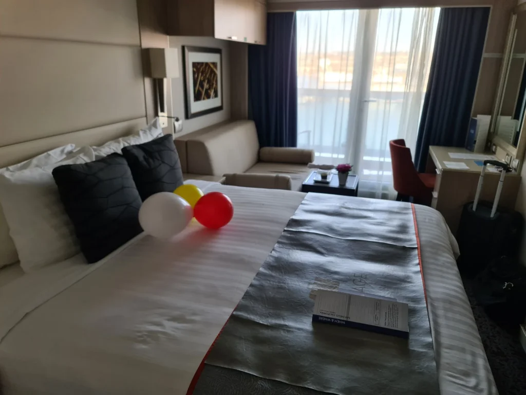 Cruising with Danny and Peter, Holland America Line, Koningsdam, San Diego, California, United States | Guests enjoying a seamless Cruise Embarkation Day with a special Birthday Celebration on Cruise Ship, featuring a warm welcome, joyful moments, and a festive atmosphere on the deck.