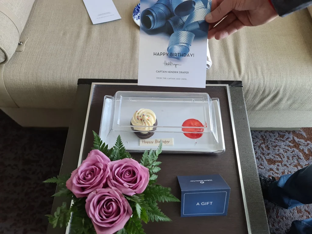 Cruising with Danny and Peter, Holland America Line, Koningsdam, San Diego, California, United States | Guests enjoying a seamless Cruise Embarkation Day with a special Birthday Celebration on Cruise Ship, featuring a warm welcome, joyful moments, and a festive atmosphere on the deck.