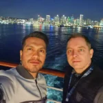 Cruising with Danny and Peter, Holland America Line, Koningsdam, San Diego, California, United States | Guests enjoying a seamless Cruise Embarkation Day with a special Birthday Celebration on Cruise Ship, featuring a warm welcome, joyful moments, and a festive atmosphere on the deck.