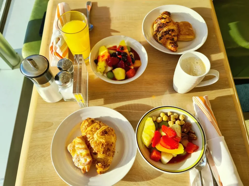 Cruising with Danny and Peter, Holland America Line, Koningsdam, Avalon, California, United States | Scenic Avalon Biking Adventures showcasing coastal views, cyclists on charming trails, Wrigley Memorial Gardens, and Catalina Island landscapes on an island biking tour.