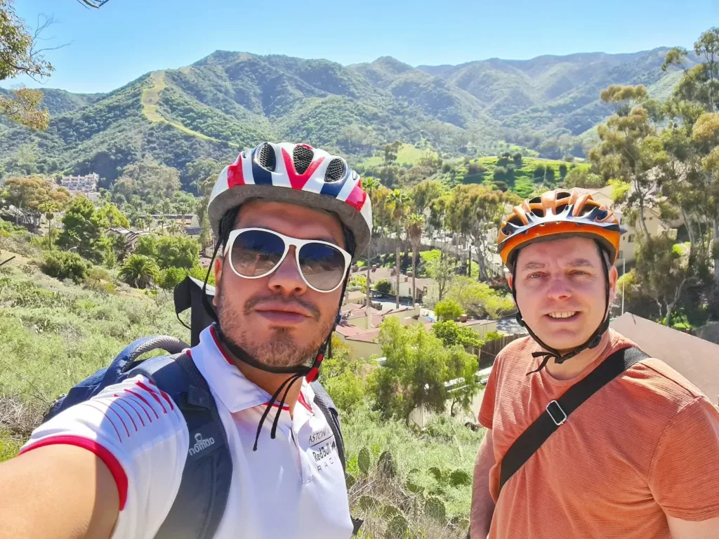 Cruising with Danny and Peter, Holland America Line, Koningsdam, Avalon, California, United States | Scenic Avalon Biking Adventures showcasing coastal views, cyclists on charming trails, Wrigley Memorial Gardens, and Catalina Island landscapes on an island biking tour.