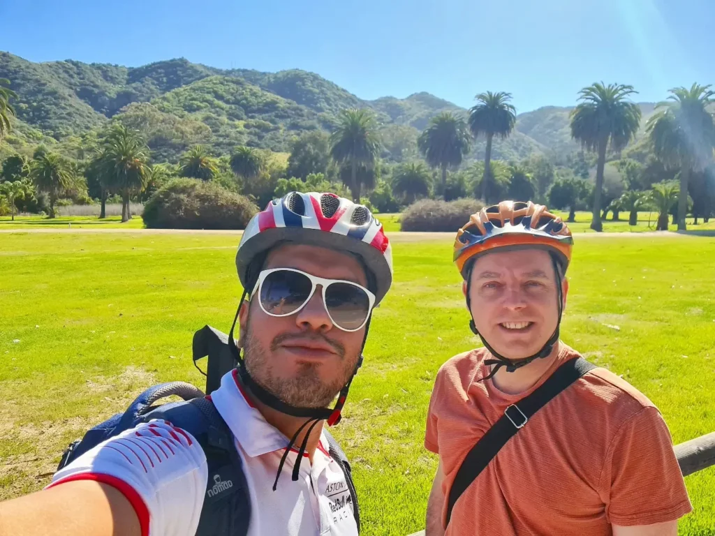 Cruising with Danny and Peter, Holland America Line, Koningsdam, Avalon, California, United States | Scenic Avalon Biking Adventures showcasing coastal views, cyclists on charming trails, Wrigley Memorial Gardens, and Catalina Island landscapes on an island biking tour.