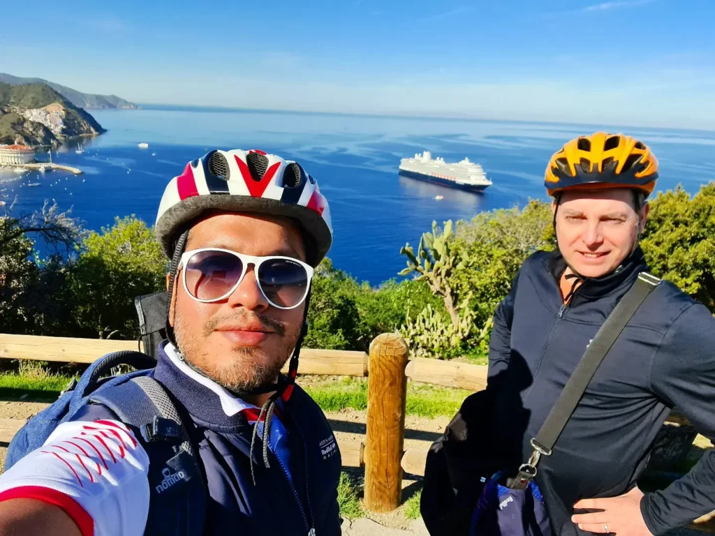 Cruising with Danny and Peter, Holland America Line, Koningsdam, Avalon, California, United States | Scenic Avalon Biking Adventures showcasing coastal views, cyclists on charming trails, Wrigley Memorial Gardens, and Catalina Island landscapes on an island biking tour.