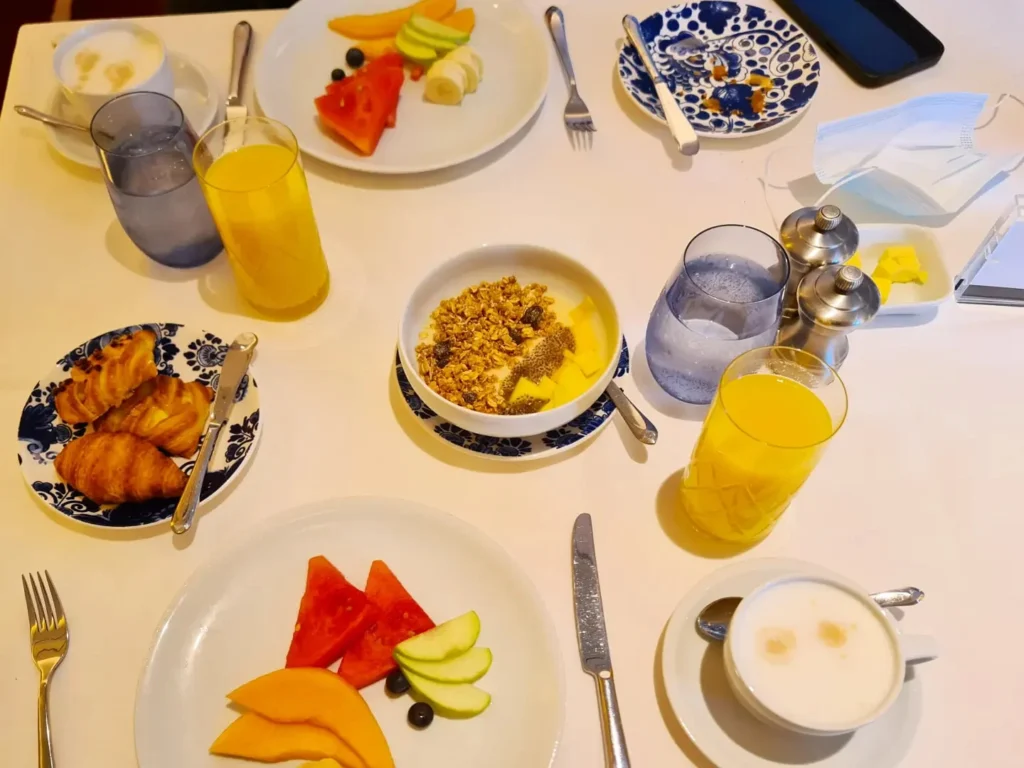 Cruising with Danny and Peter, Holland America Line, Koningsdam, Pacific Ocean, Sea Day | Guests enjoying a Hawaiian cruise experience, participating in cultural activities at sea, including lei-making, ukulele workshops, and hula dance lessons, surrounded by the beauty of the ocean and the spirit of Aloha.