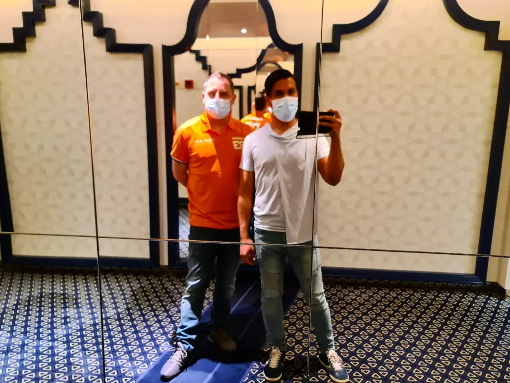 Cruising with Danny and Peter, Holland America Line, Koningsdam, Pacific Ocean, Sea Day | Passengers enjoying a tranquil Holland America sea day aboard a luxury cruise ship, participating in ocean voyage activities such as ukulele lessons, savoring gourmet dining at sea, and relaxing by the pool while overlooking the serene waters. The elegant ship provides panoramic ocean views and a perfect setting for a memorable Holland America Line experience. The day also includes presentations on maritime history, reflecting the ultimate luxury travel experience at sea.