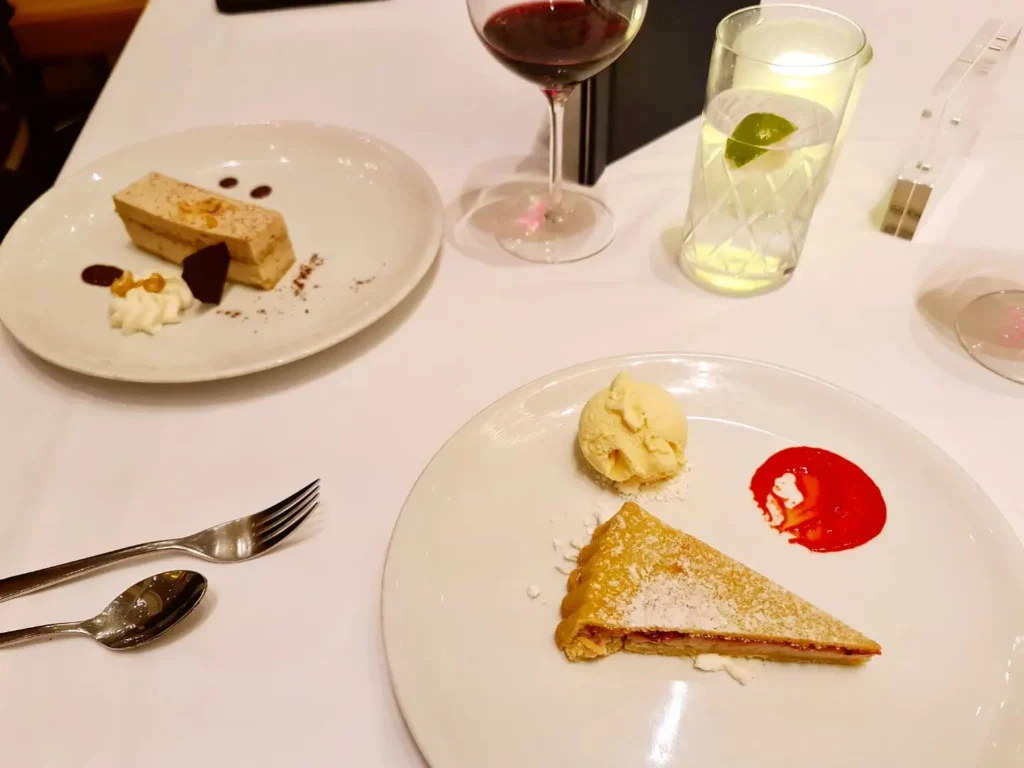 Cruising with Danny and Peter, Holland America Line, Koningsdam, Pacific Ocean, Sea Day | Passengers enjoying a tranquil Holland America sea day aboard a luxury cruise ship, participating in ocean voyage activities such as ukulele lessons, savoring gourmet dining at sea, and relaxing by the pool while overlooking the serene waters. The elegant ship provides panoramic ocean views and a perfect setting for a memorable Holland America Line experience. The day also includes presentations on maritime history, reflecting the ultimate luxury travel experience at sea.