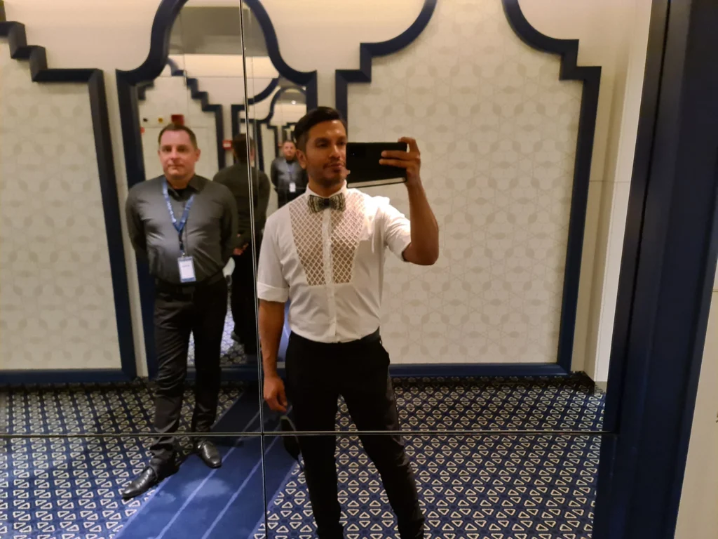 Cruising with Danny and Peter, Holland America Line, Koningsdam, Pacific Ocean, Sea Day | A breathtaking view of the ocean during a Relaxing Cruise Day at Sea Adventure, showcasing scenic ocean views and the cruise ship gliding over the waves. Guests enjoy onboard activities, sipping cocktails by the poolside, and indulging in a gourmet cruise ship dining experience in the elegant dining room, surrounded by a vibrant atmosphere and happy passengers. The sun sets in the background, adding warmth to the leisure at sea.