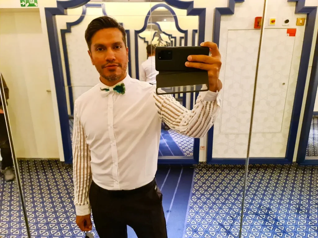 Cruising with Danny and Peter, Holland America Line, Koningsdam, Pacific Ocean, Sea Day | Group of travelers enjoying ukulele lessons on the deck of a cruise ship during an ocean voyage. Vibrant sunset over the sea, showcasing the essence of Hawaiian culture. Participants performing in a live music at sea event, celebrating their ukulele performances together, surrounded by the beauty of the ocean and the warmth of camaraderie.