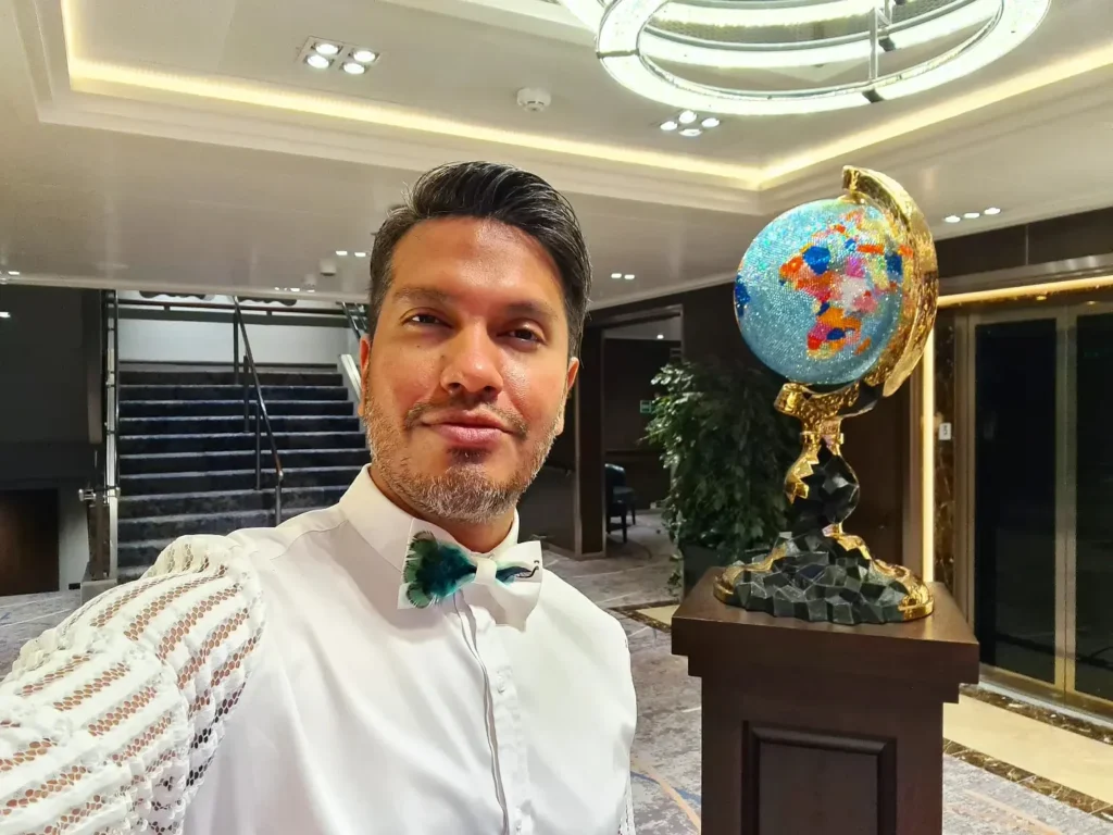 Cruising with Danny and Peter, Holland America Line, Koningsdam, Pacific Ocean, Sea Day | Group of travelers enjoying ukulele lessons on the deck of a cruise ship during an ocean voyage. Vibrant sunset over the sea, showcasing the essence of Hawaiian culture. Participants performing in a live music at sea event, celebrating their ukulele performances together, surrounded by the beauty of the ocean and the warmth of camaraderie.