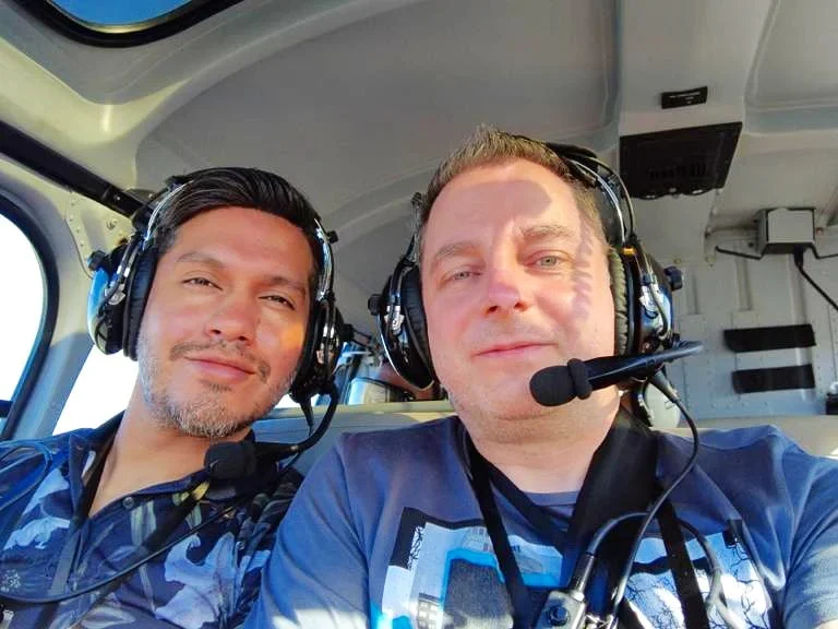 Cruising with Danny and Peter, Holland America Line, Koningsdam, Honolulu, Hawaii, United States | Stunning aerial view of Waikiki Beach from a Hawaii helicopter tour, capturing the turquoise waters, golden sands, and iconic skyline. Majestic Ko'olau Mountains flight showcasing the lush, rugged peaks of Oahu from above. Pearl Harbor aerial view offering a solemn and powerful glimpse of the historic site. Scenic helicopter ride over Hawaii’s coast, revealing the island’s breathtaking landscapes and vibrant colors. An unforgettable Hawaii sightseeing adventure highlighting the beauty of Oahu’s windward coast, north shore, and serene tropical rainforests.