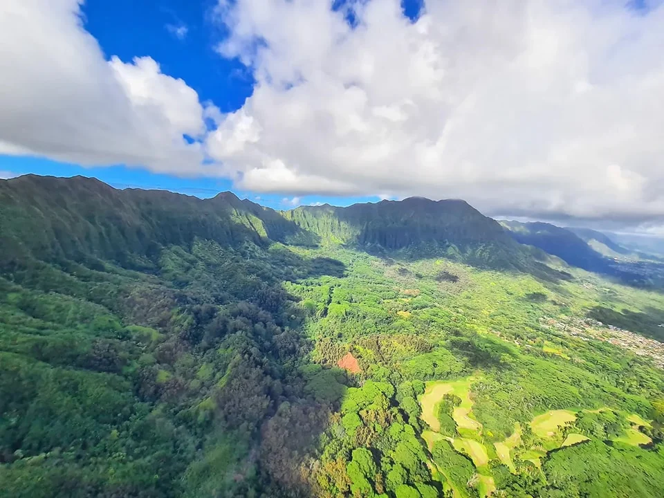 Cruising with Danny and Peter, Holland America Line, Koningsdam, Honolulu, Hawaii, United States | Stunning aerial view of Waikiki Beach from a Hawaii helicopter tour, capturing the turquoise waters, golden sands, and iconic skyline. Majestic Ko'olau Mountains flight showcasing the lush, rugged peaks of Oahu from above. Pearl Harbor aerial view offering a solemn and powerful glimpse of the historic site. Scenic helicopter ride over Hawaii’s coast, revealing the island’s breathtaking landscapes and vibrant colors. An unforgettable Hawaii sightseeing adventure highlighting the beauty of Oahu’s windward coast, north shore, and serene tropical rainforests.