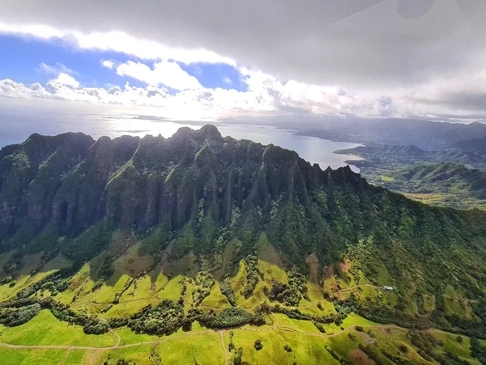 Cruising with Danny and Peter, Holland America Line, Koningsdam, Honolulu, Hawaii, United States | Stunning aerial view of Waikiki Beach from a Hawaii helicopter tour, capturing the turquoise waters, golden sands, and iconic skyline. Majestic Ko'olau Mountains flight showcasing the lush, rugged peaks of Oahu from above. Pearl Harbor aerial view offering a solemn and powerful glimpse of the historic site. Scenic helicopter ride over Hawaii’s coast, revealing the island’s breathtaking landscapes and vibrant colors. An unforgettable Hawaii sightseeing adventure highlighting the beauty of Oahu’s windward coast, north shore, and serene tropical rainforests.