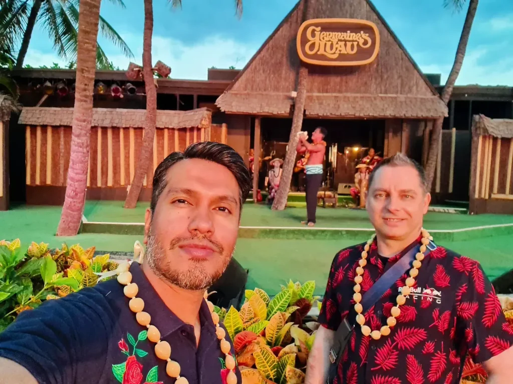 Cruising with Danny and Peter, Holland America Line, Koningsdam, Honolulu, Hawaii, United States | Breathtaking views from the Diamond Head summit during the hike, showcasing scenic views of Honolulu and Waikiki Beach, capturing the essence of volcano hiking in Hawaii, followed by a vibrant scene from Germaine's Luau, highlighting traditional Hawaiian feast, cultural events in Hawaii, and mesmerizing Hawaiian dance performances, all reflecting the rich Polynesian culture and Hawaiian hospitality.