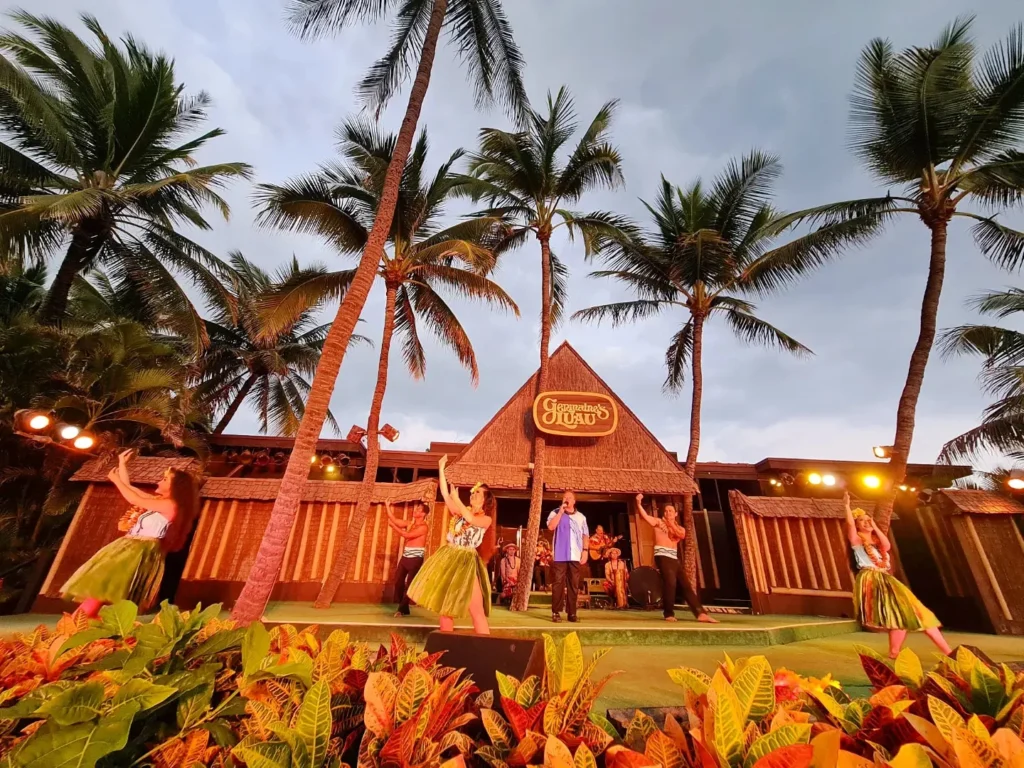 Cruising with Danny and Peter, Holland America Line, Koningsdam, Honolulu, Hawaii, United States | Breathtaking views from the Diamond Head summit during the hike, showcasing scenic views of Honolulu and Waikiki Beach, capturing the essence of volcano hiking in Hawaii, followed by a vibrant scene from Germaine's Luau, highlighting traditional Hawaiian feast, cultural events in Hawaii, and mesmerizing Hawaiian dance performances, all reflecting the rich Polynesian culture and Hawaiian hospitality.